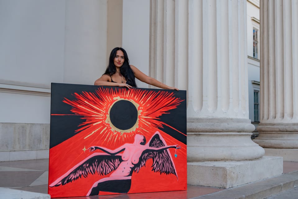 Laura holding Ascension between stone columns